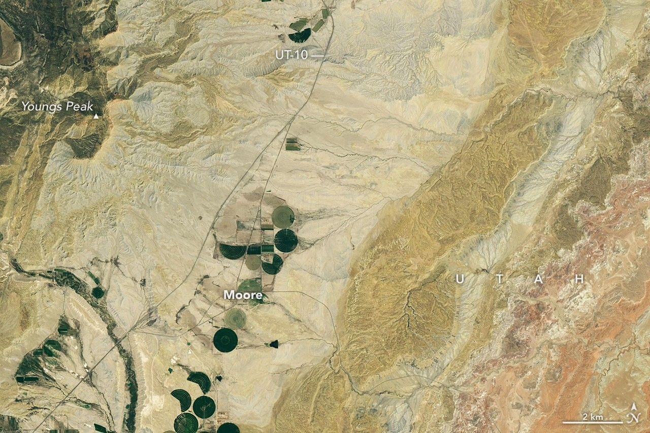 Landsat 8 image of Castle Valley, Utah, on June 16, 2024, showing dry valley with few irrigated fields before solar farm construction.